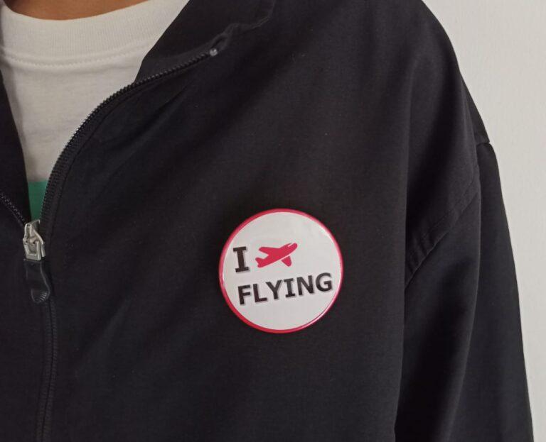 Image of Pin Badge 'I Love Flying' White on Jacket