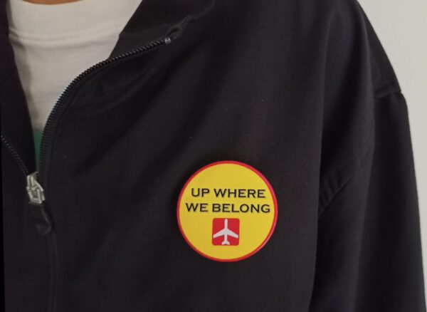 Image of Pin Badge 'Up Where We Belong' on Jacket